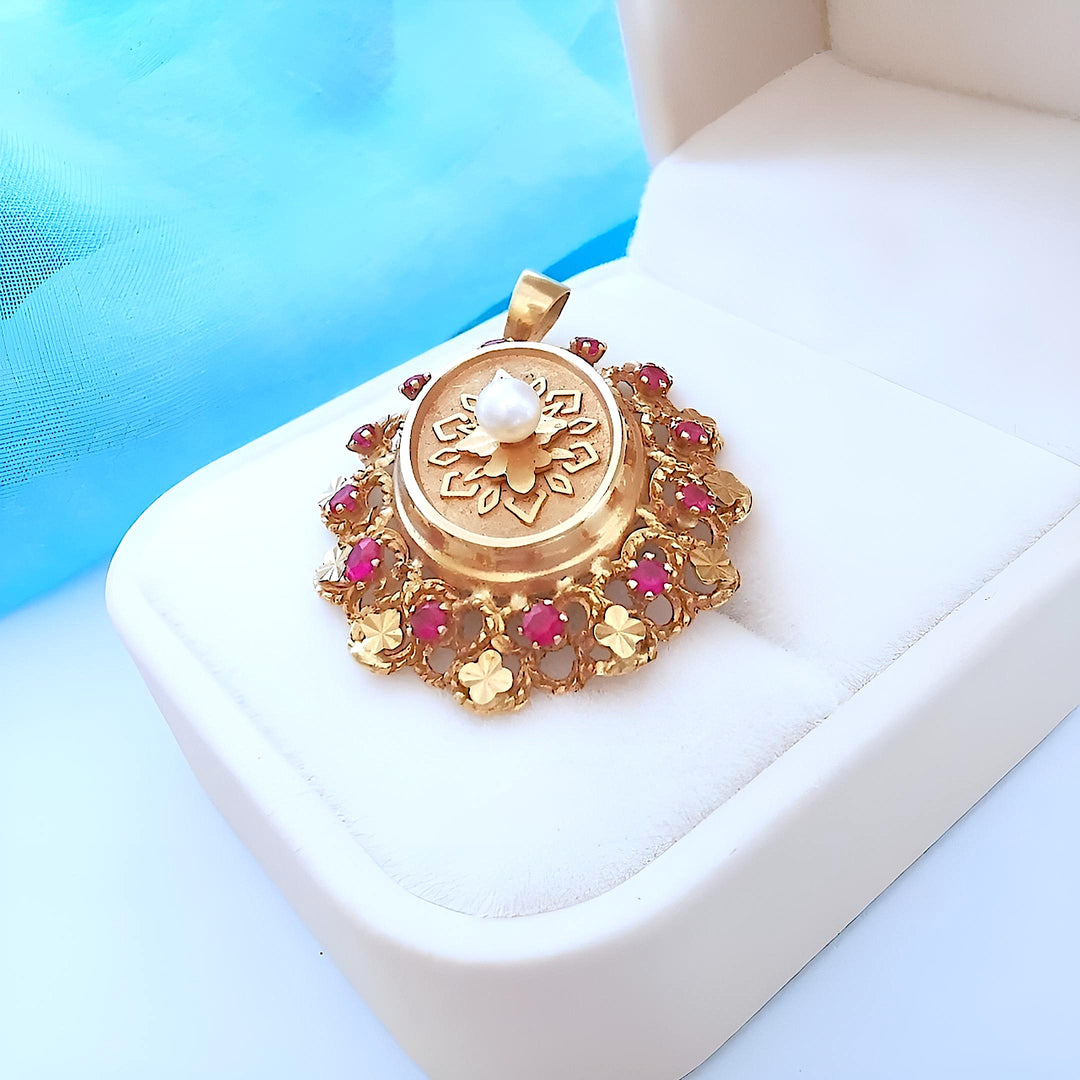 photo Joaillerie de seconde main – Médaillon or rose 18K et perle blanche