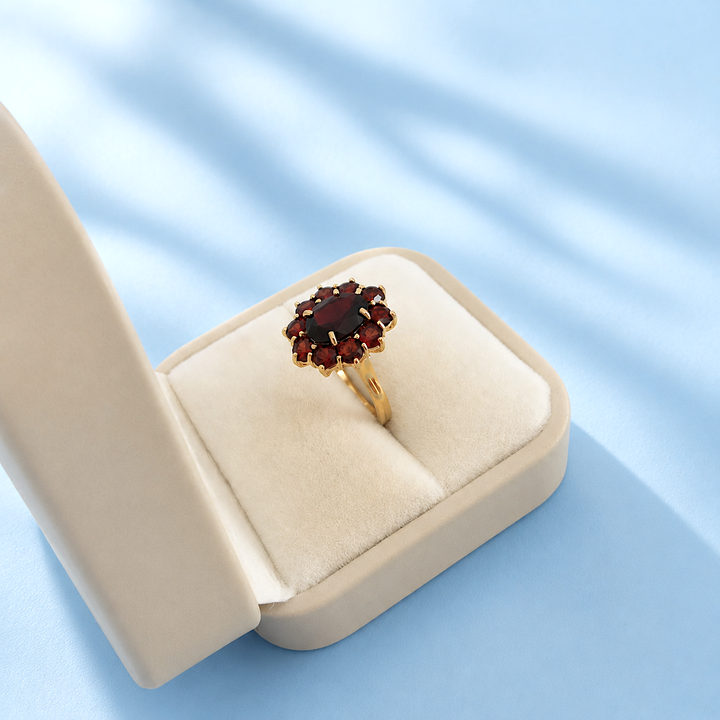 Bague d'occasion grenat marguerite en or 18 carats pour femme
