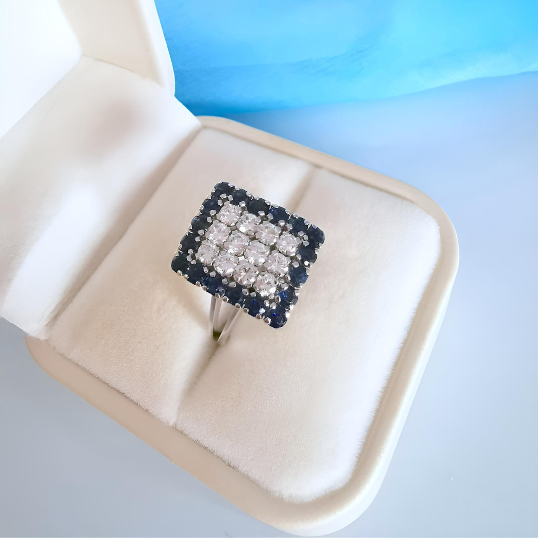 photo bague dans un écrin joaillerie circulaire vintage saphir diamant