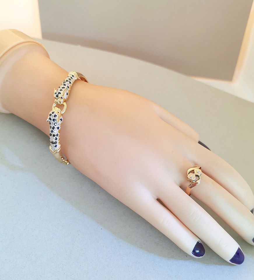 Bracelet ouvrant / 2 têtes de Panthère / Or 18 K / Diamants / Saphirs / 18 carats / 750