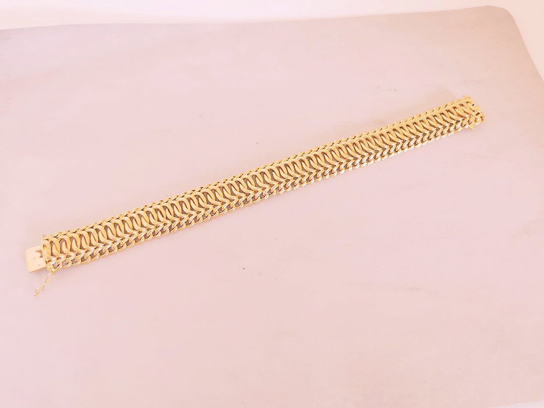 Bracelet Ruban / Gourmette / Maille entrelacée / Or 18 K / 26,38 gr / Or 18 carats / (750°/°°)