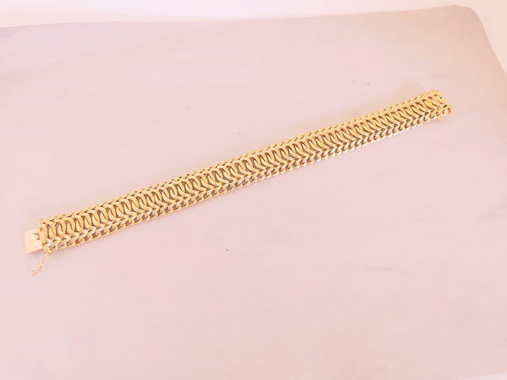 Bracelet Ruban / Gourmette / Maille entrelacée / Or 18 K / 26,38 gr / Or 18 carats / (750°/°°)