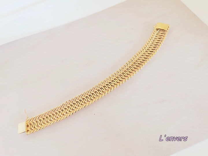 Bracelet Ruban / Gourmette / Maille entrelacée / Or 18 K / 26,38 gr / Or 18 carats / (750°/°°)