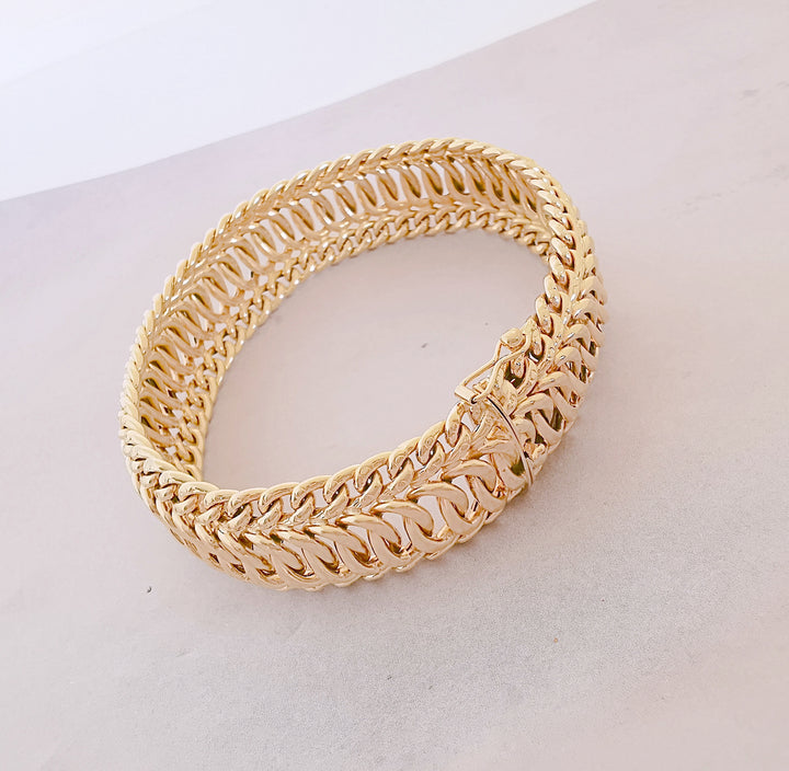 Bracelet Ruban / Gourmette / Maille entrelacée / Or 18 K / 26,38 gr / Or 18 carats / (750°/°°)