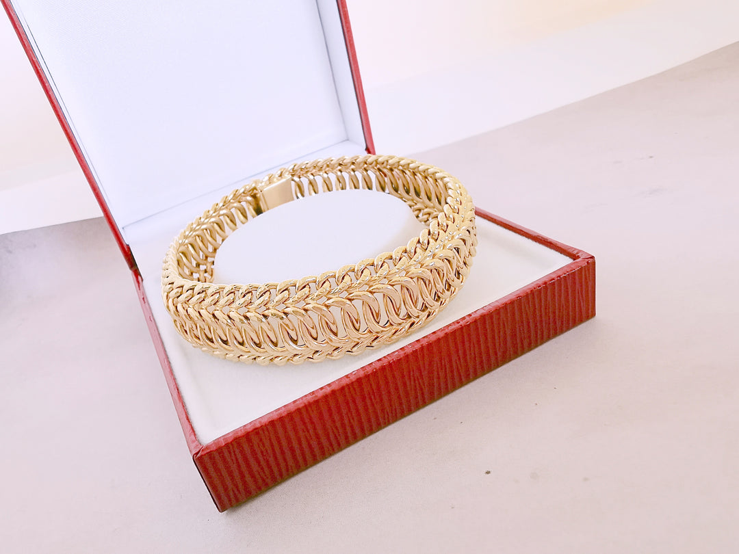 Bracelet Ruban / Gourmette / Maille entrelacée / Or 18 K / 26,38 gr / Or 18 carats / (750°/°°)