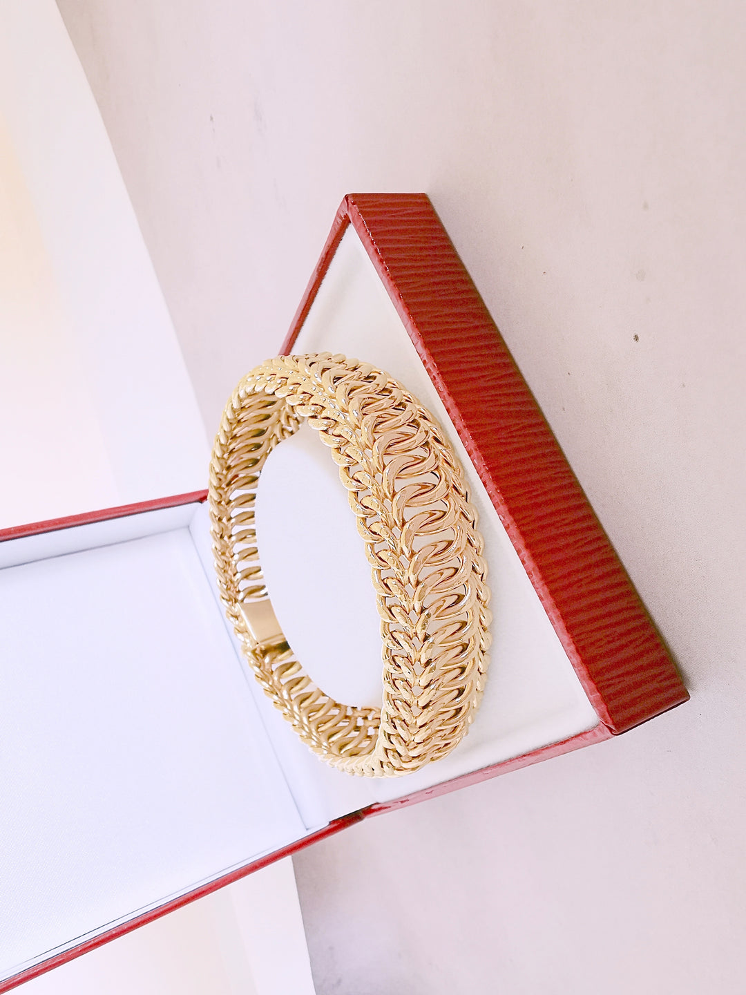 Bracelet Ruban / Gourmette / Maille entrelacée / Or 18 K / 26,38 gr / Or 18 carats / (750°/°°)