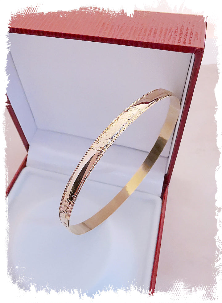 Bracelet Jonc rigide / Volutes / Or Jaune 18 K / 18 carats / (750°/°°)