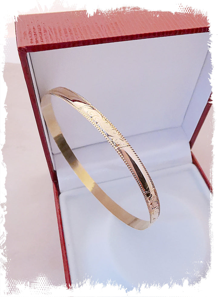 Bracelet Jonc rigide / Volutes / Or Jaune 18 K / 18 carats / (750°/°°)