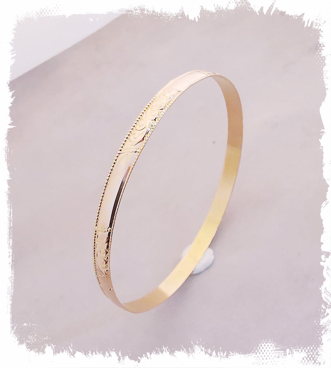 Bracelet Jonc rigide / Volutes / Or Jaune 18 K / 18 carats / (750°/°°)